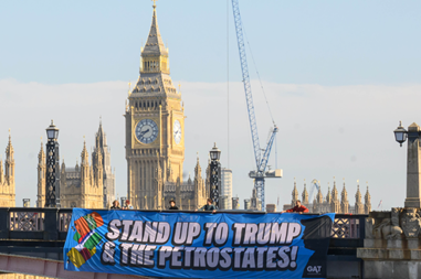Climate Activists Greet IMO Delegates with Massive Banners Demanding: “Stand Up to Trump & the Petrostates! Green Shipping Now!”